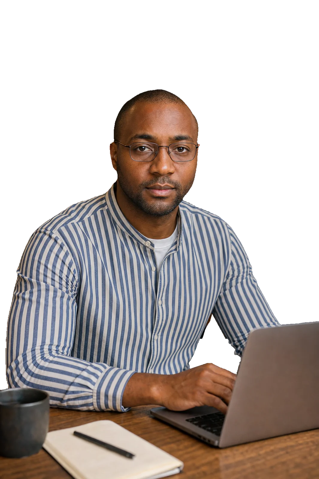 Rodney L. Lewis working at a laptop